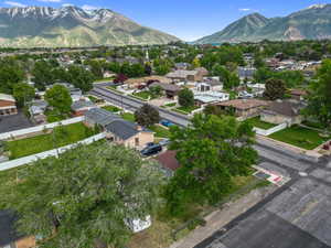 Aerial perspective of suburban area with a mountain backdrop