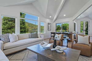Living room featuring light wood-type flooring, healthy amount of natural light, baseboards, french doors, and recessed lighting