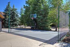 View of basketball court with a tennis court