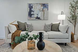 Living area featuring wood finished floors and baseboards