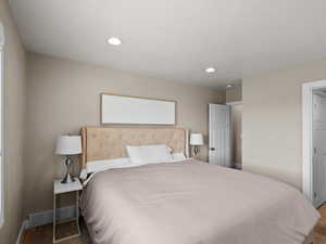 Bedroom with baseboards, carpet, and recessed lighting