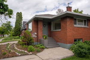 View of front of home featuring solid brick and new roof!
