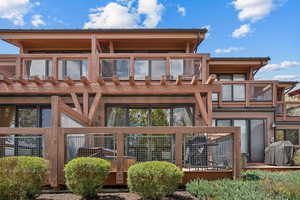 Rear view of house featuring a balcony