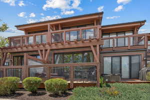 Rear view of house featuring a balcony