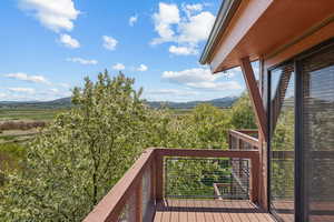 Wooden deck featuring a mountain view
