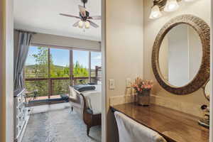 Bathroom with ceiling fan and vanity