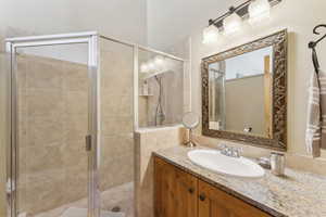 Full bath with vanity and a stall shower