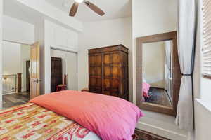 Bedroom featuring a closet, wood finished floors, and a ceiling fan