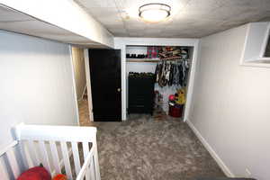Bedroom featuring carpet floors and a closet