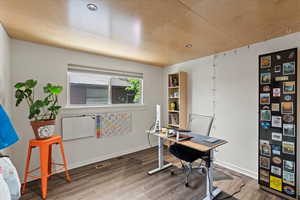 Office featuring wood finished floors, baseboards, and recessed lighting