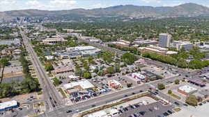 View of urban area with a mountain backdrop and a highway
