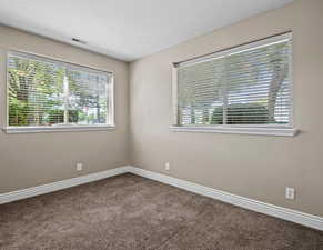 Bedroom in the lower level ADU with no window wells, 9ft ceilings and double windows