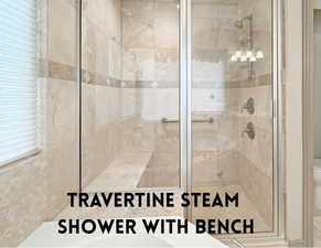 Travertine steam shower with rain head and bench