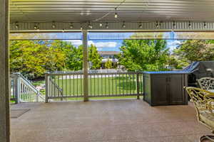 View of your fully fence backyard from the covered deck