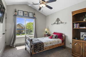 One of 4 upstairs bedrooms with a ceiling and vaulted ceilings