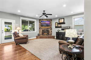 Large open great room perfect for entertaining. Featuring a cozy fireplace and hickory hardwood floors, there are French doors that lead out to your covered deck.