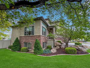 Lush landscaping surrounds this spacious home