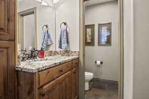 Half bath located on the main floor with tons of storage and granite countertop
