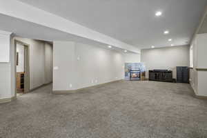 Family room with 9 foot ceilings, cozy gas fireplace, open to the kitchen and dining area.