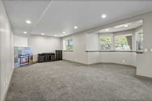 Family room with 9 foot ceilings, cozy gas fireplace, open to the kitchen and dining area.