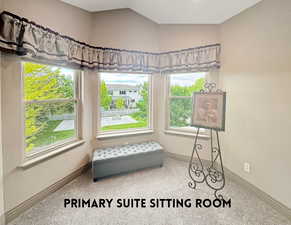 Seating alcove in the primary suite overlooking your park-like backyard