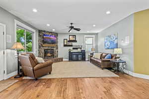 Large open great room perfect for entertaining. Featuring a cozy fireplace and hickory hardwood floors, there are French doors that lead out to your covered deck.
