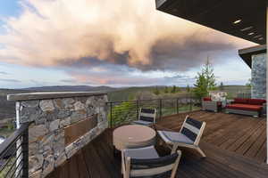Deck at dusk with outdoor lounge area