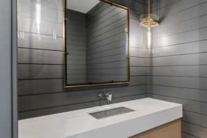 Bathroom featuring vanity and a shower