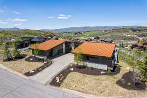 View of subject property with mountains