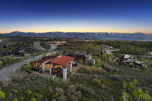 Aerial overview of property's location with a mountain backdrop