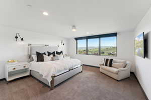 Carpeted bedroom with baseboards and recessed lighting