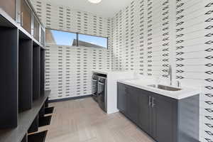 Laundry room featuring cabinet space and washer and dryer