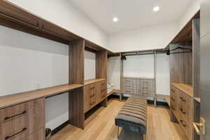 Walk in closet featuring light wood-style flooring