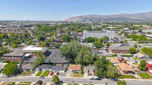 Aerial perspective of suburban area with a mountain backdrop