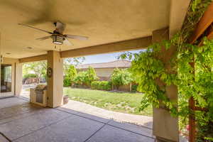 View of patio / terrace with a ceiling fan and exterior kitchen