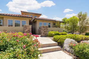 Mediterranean / spanish-style home featuring stucco siding and a tile roof