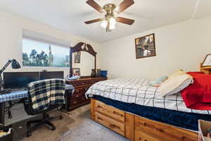Bedroom featuring carpet flooring and a ceiling fan