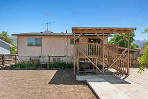 Rear view of property with a patio