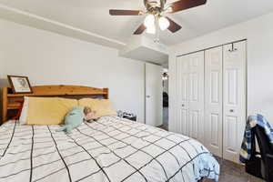 Bedroom featuring carpet flooring, a closet, and ceiling fan