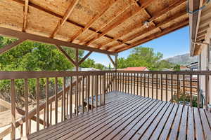 Wooden terrace featuring a mountain view