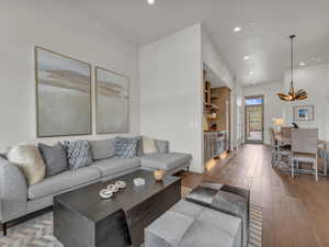 Living area featuring recessed lighting and wood-type flooring