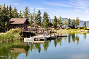 Dock with a water and mountain view