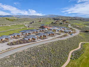 Aerial view of residential area featuring a mountainous background