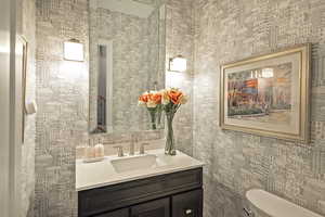 Bathroom featuring vanity and toilet