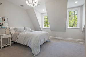 Bedroom with baseboards, carpet flooring, a chandelier, recessed lighting, and lofted ceiling