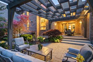View of patio with an outdoor living space, a pergola, and outdoor dining space