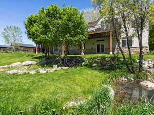 Rear view of property overlooking a running stream