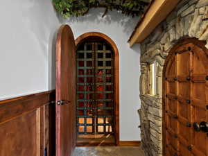 Wine room with gated and arched entry