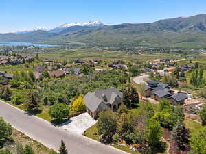 Aerial view of property surrounded by five acres of unbuildable woodlands with protected lake and mountain views