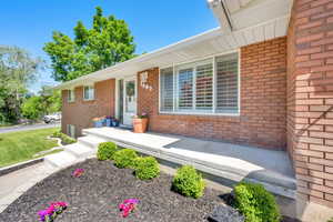 View of front of house with brick siding